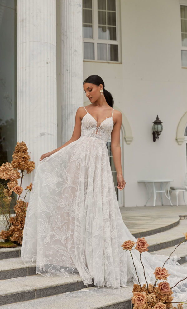 DUNE-ML22141-FULL-LENGTH-FLORAL-LACE-ALINE-GOWN-WITH-THIN-STRAPS-PLUNGING-NECKLINE-ILLUSION-BODICE-LOW-BACK-BUTTON-AND-ZIPPER-CLOSURE-WEDDING-DRESS-MADI-LANE-BRIDAL-1